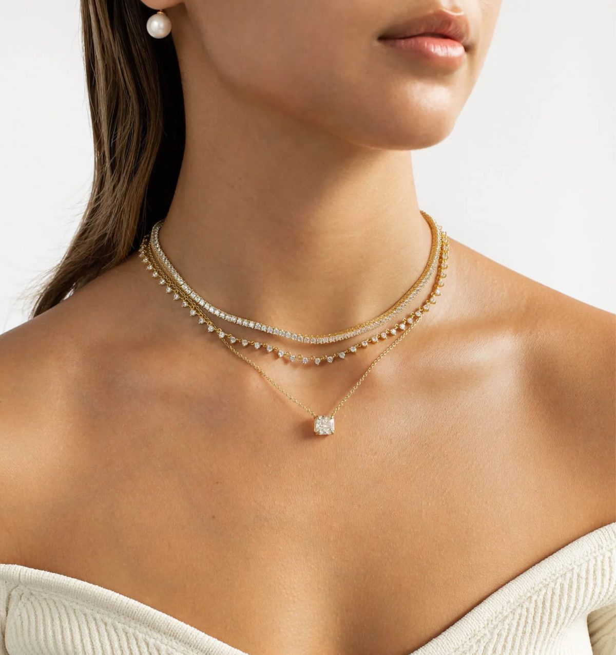 Layered gold necklaces worn as a push present