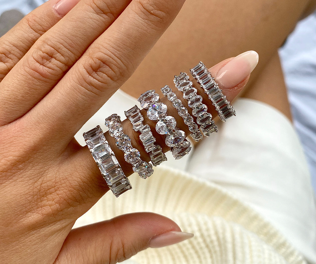 eternity bands stacked on an index finger