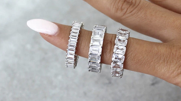 three eternity rings on an index finger