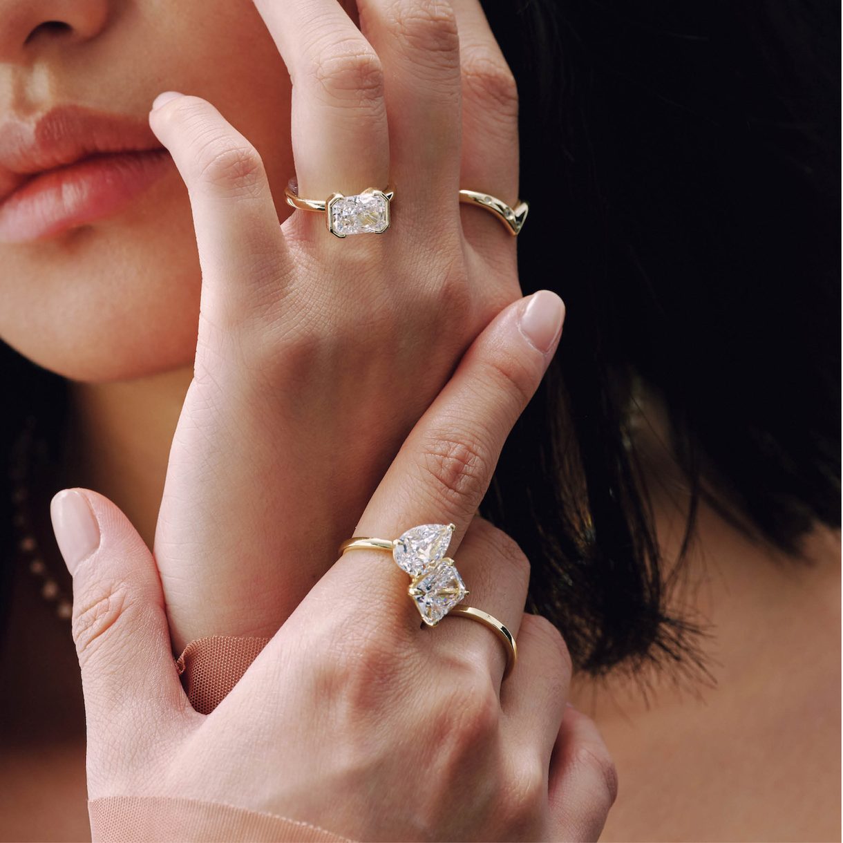 Push present rings stacked on a hand