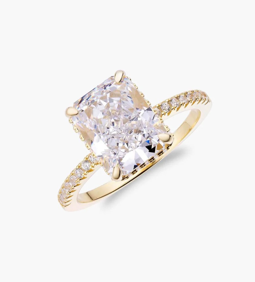 Gold travel ring with a cushion-cut stone