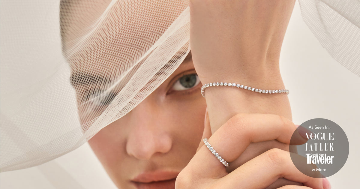 Model wearing an OBJKTS tennis bracelet and eternity ring, as seen in Vogue, Tatler and Condé Nast Traveler