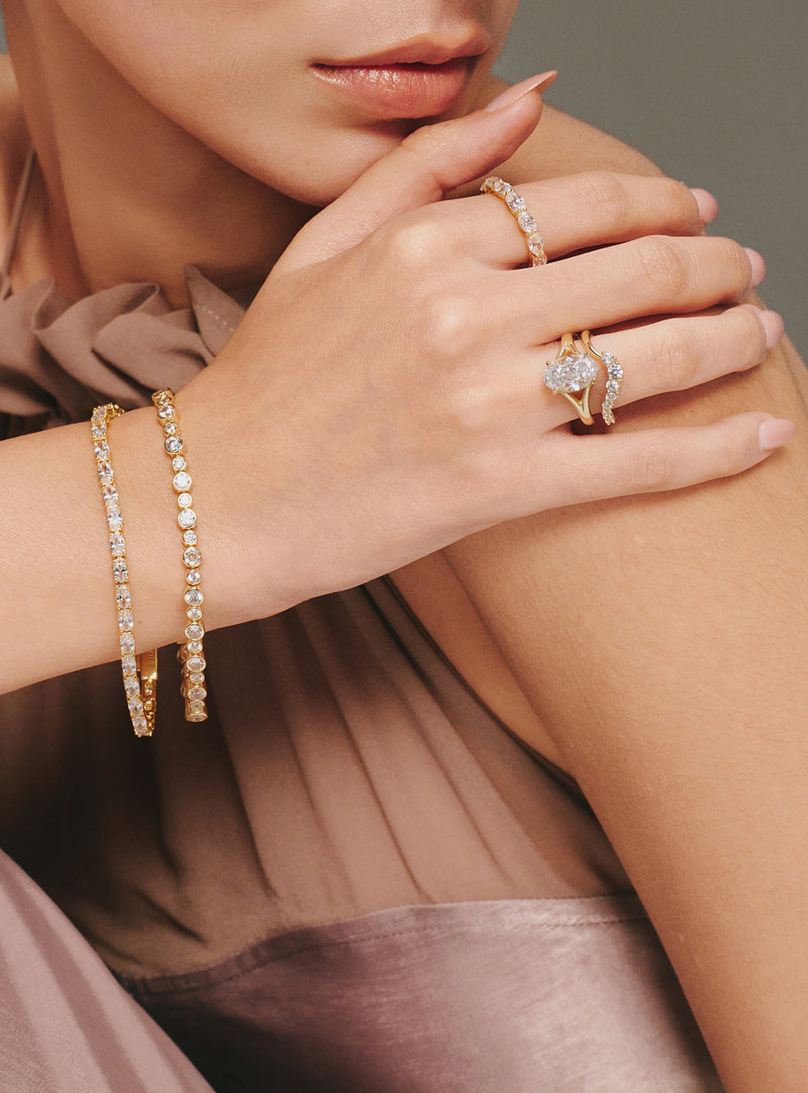 Tennis bracelets and rings styled for evening