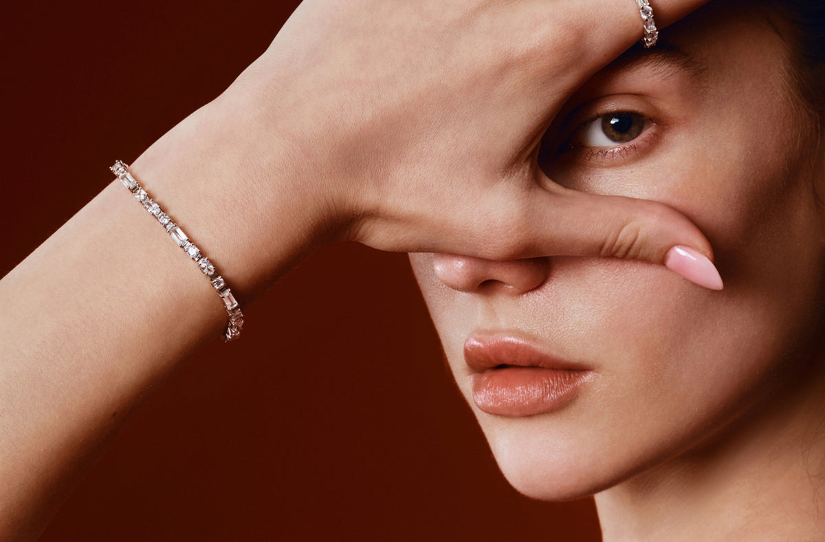 Silver tennis bracelet worn on the wrist