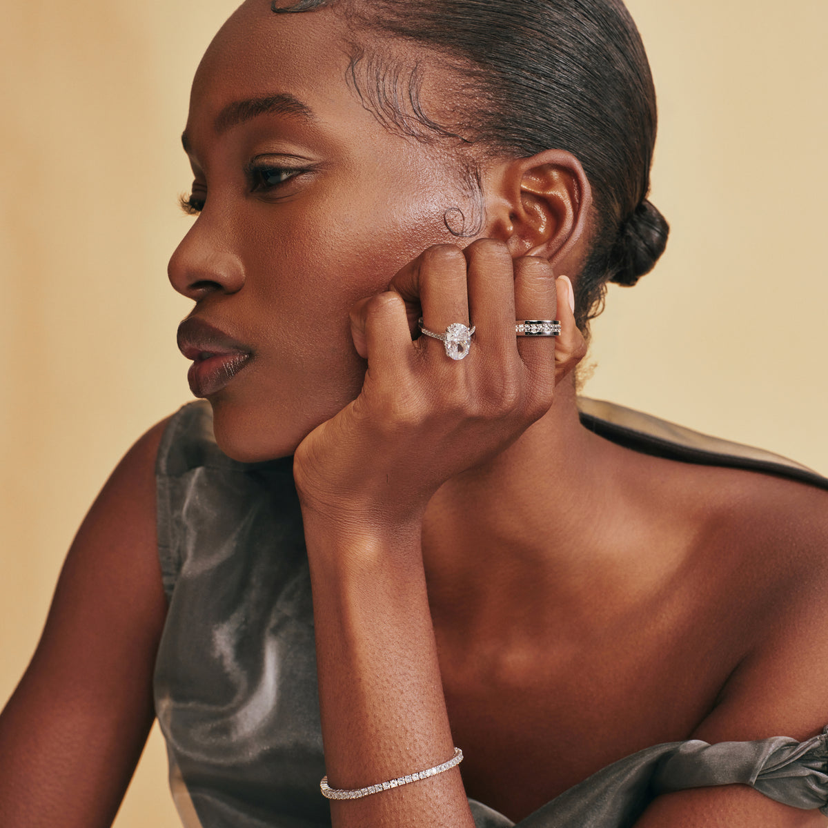 Model wearing an engagement ring and eternity band