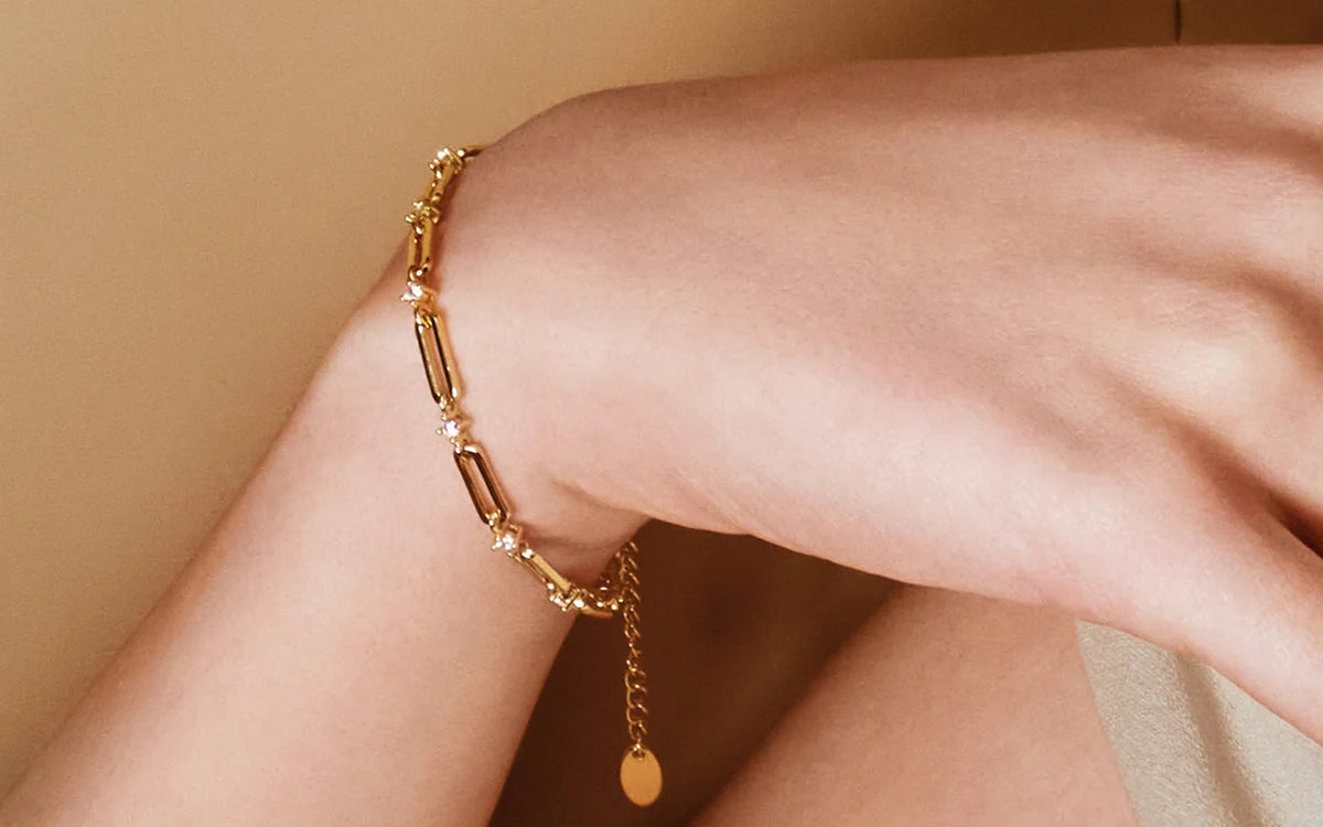 Gold chain bracelet on a wrist